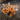 Corgi puppy sleeping on top of brown colored Snuggle Puppy calming plush toy for dogs