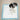 Small black and white puppy squating down on a Snuggle Puppy training pad covering a hardwood floor