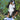 Bernese Mountain Dog sitting next to a gray low stuffy fox dog toy