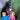 Black dog with bandana and two brown Tender-Tuffs dog astronaut toys in a blue space suit and a pink space suit