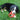 Bernese Mountain Dog puppy chewing on red heart shaped SnugglePuppy rubber teething aid chew toy in the grass